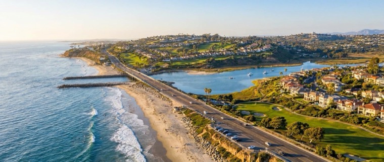 Aerial view of Carlsbad's coastline, lagoon, and beachfront homes